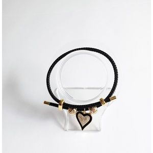 Adjustable steel wire bracelet with charm.